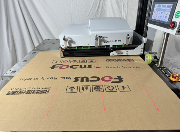 Single pass printer printing barcodes and serial numbers on corrugated shipping boxes