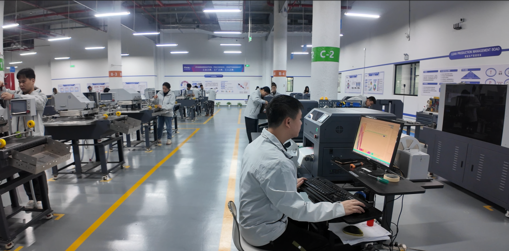 FocusInc factory quality control process: technician inspects single pass digital printer functions and performance before shipment, with standardized packaging and labeling for industrial printing equipment