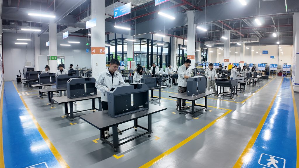 Focusinc NEXUS-350J all-in-one label printing and die cutting machine installed on production line in factory workshop