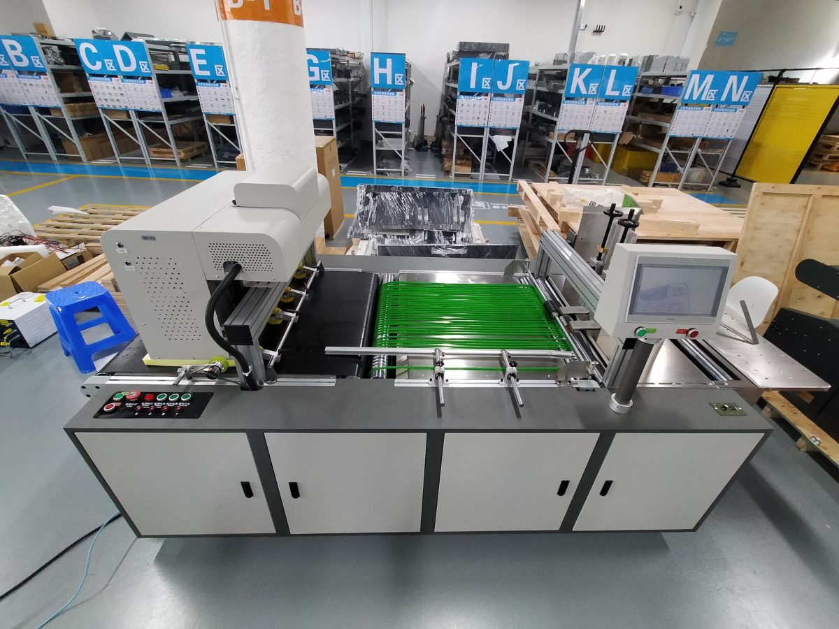 FocusInc single pass printer with green conveyor belt for sheet material printing