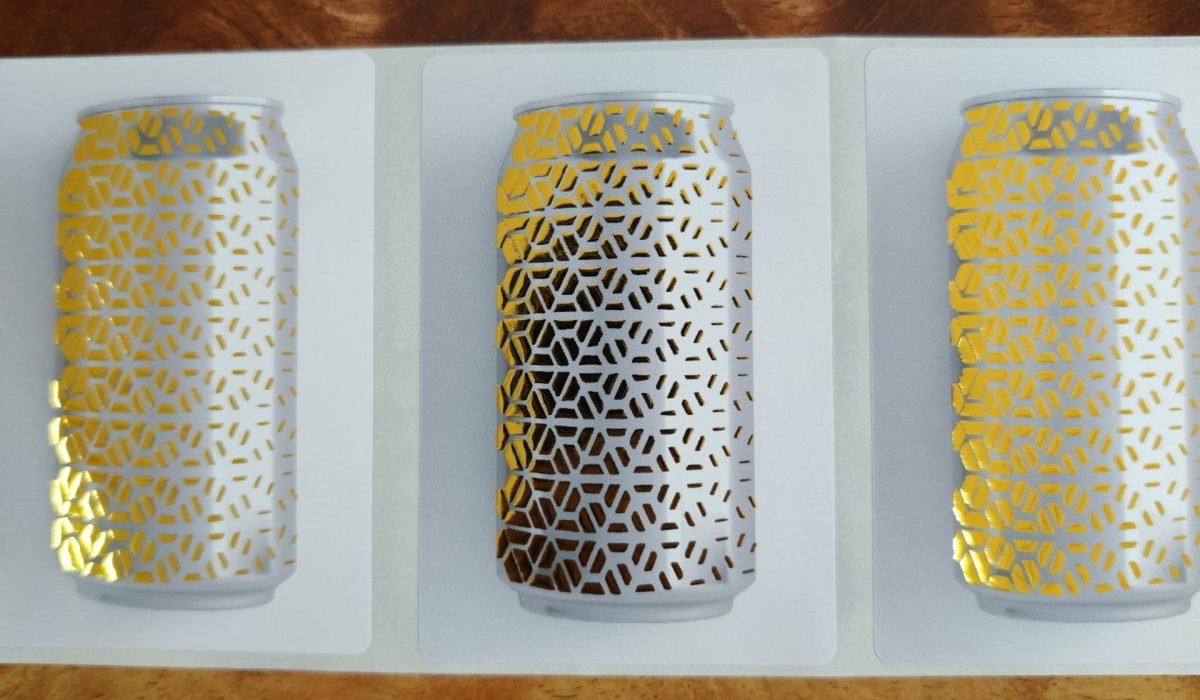 Focusinc NEXUS-350J label sample with precise partial gold foil stamping over UV varnish, showcasing premium metallic finish