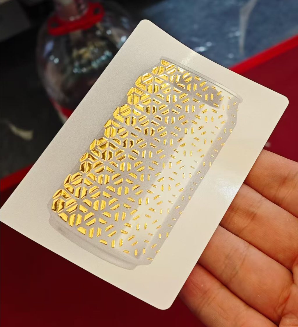 Focusinc NEXUS-350J label sample with partial gold foil stamping effect, showing premium metallic finish on printed label
